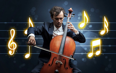 Young handsome cellist playing with music sheet background
