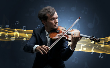 Young male musician playing on his violin with musical notes around