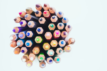 Close up seamless colored pencils row isolated on white background. Colorful pencils with copy space for your text.