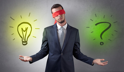 Covered eye businessman with bulb and question sign symbols around