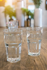 A Glass of water in glass on table.