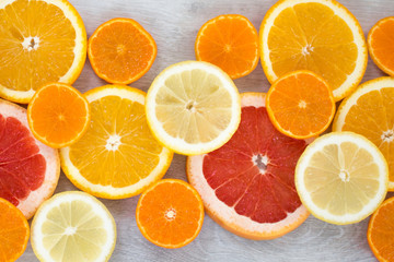 Sliced juicy orange, lemon, grapefruit and mandarin background