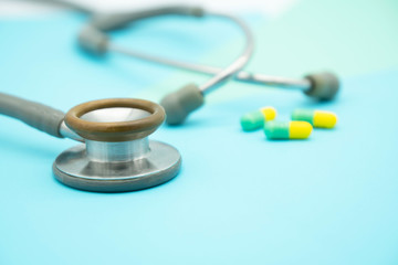 closeup Medical equipment Stethoscope and drug on colorful pastel paper for background .