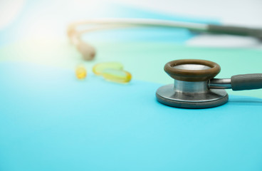 closeup Medical equipment Stethoscope and drug on colorful pastel paper for background .
