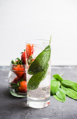 Fresh cocktail with ripe strawberry and sage leaves. Selective focus.
