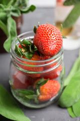 Fresh cocktail with ripe strawberry and sage leaves. Selective focus.