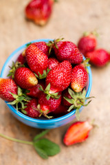 Fresh berry in a blue bowl