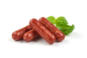 Salami smoked sausages with herbs isolated on white background