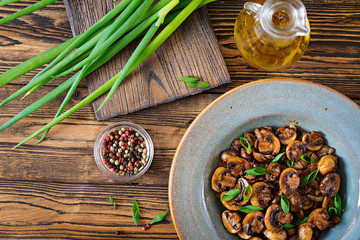 Baked mushrooms with soy sauce and herbs. Vegan food. Top view