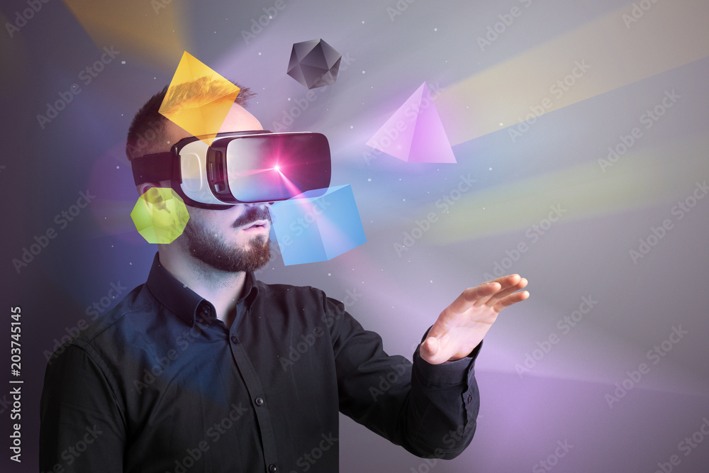 Poster amazed businessman with virtual reality colorful geometric shapes in front of him