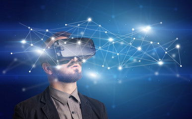 Amazed businessman with virtual reality network concept in front of him