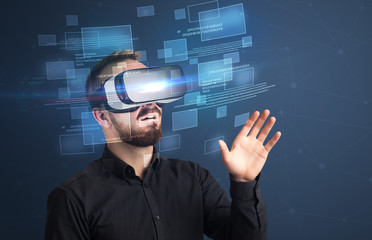 Amazed businessman with virtual reality data and blue squares in front of him 