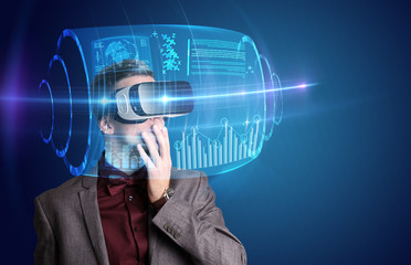 Amazed businessman with high tech 3D projection in front of him 