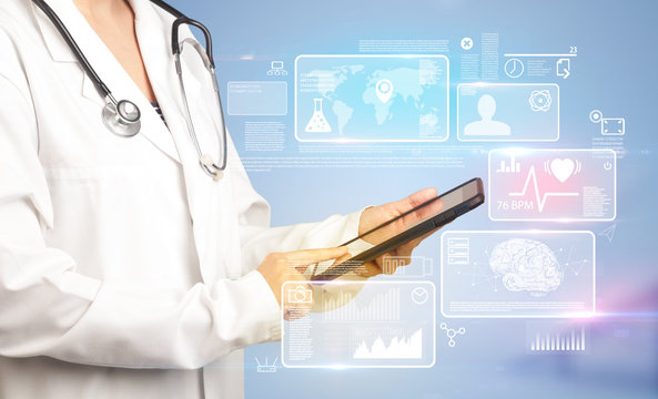 Female doctor holding tablet with blue background and informative graphs and charts 