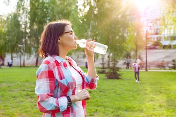 Woman drinking water from bottle