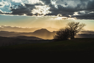 Fototapeta premium Mountain peaks in Emilia Romagna at sunset. Monte Venere, Bologna province, Italy.