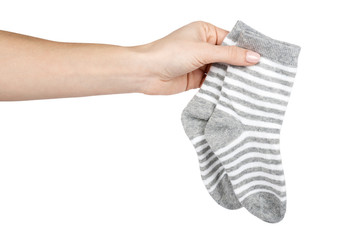 Cotton kid socks with hand, isolated on white background