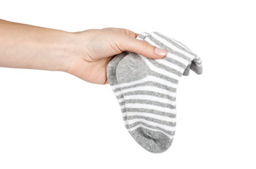 Cotton kid socks with hand, isolated on white background