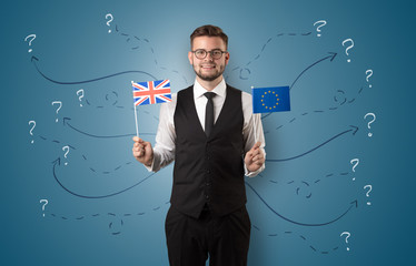 Smiling young man standing with flag and multidirectional arrows around
