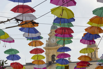Fototapeta na wymiar Ornamental umbrellas hanging in Genoa