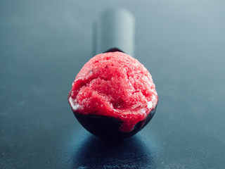 Crimson, refreshing berry ice cream and a vintage spoon for ice cream. Close-up. Homemade food. Tasty, useful, positive