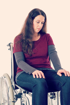 sad young woman in wheelchair