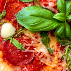 Pepperoni Pizza isolated on white background. Pizza with mozzarella cheese, Basil leaf  and tomato sauce, top view.