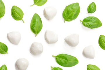 Basil and mozzarella. Food Ingredients pattern with mozarella cheese balls and fresh basil leaves,...