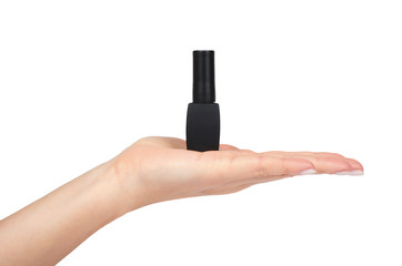 Black nail polish bottle with hand isolated on white background