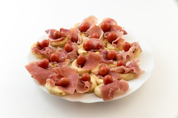 appetizer with tomatoes and ham bread