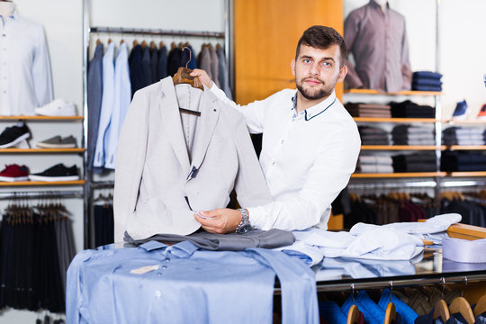 Adult man customer choosing jacket