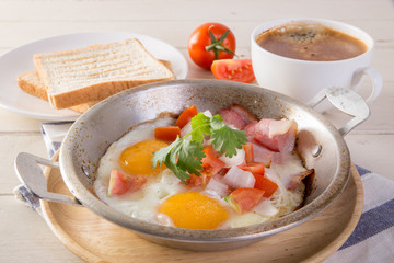 Breakfast including coffee, Egg pan, bread, 