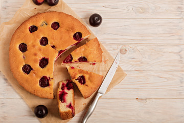 Home plum pie on baking paper.