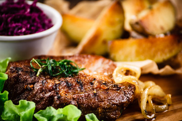Grilled steak with potatoes and vegetables
