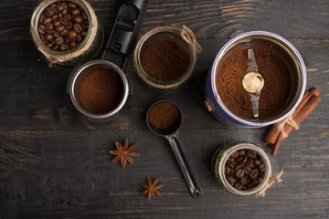 Making coffee, ground coffee, coffee beans, on a dark background, top view