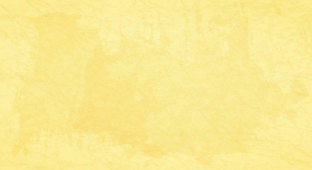 Yellow scratched background with spots of paint.