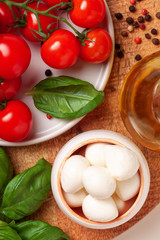 Tomatoes, basil, mozzarella cheese. Caprese salad ingredients