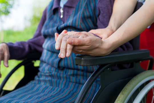 Holding hands - Parkinson disease