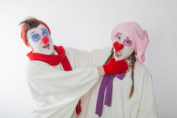 mime boy strangles mime girl. Domestic violence. Mockery. Human emotions