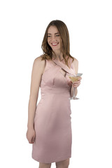 The young attractive woman in an evening dress with a glass of coctail, isolated