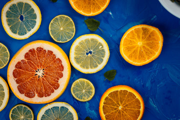 citrus slices on blue background