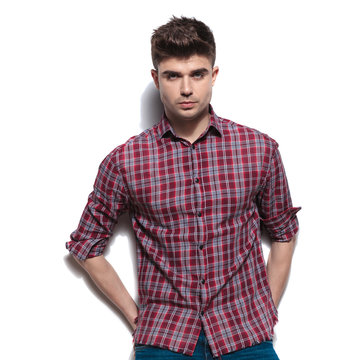 portrait of handsome relaxed man with red checkers shirt