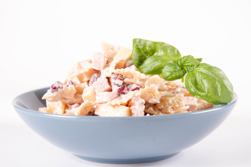 Pasta salad with cheese, ham, kidney beans and mayonnaise