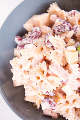 Pasta salad with cheese, ham, kidney beans and mayonnaise