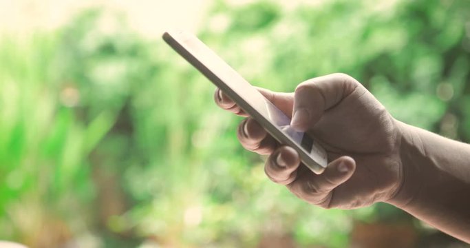 Close up hand using smartphone touching a display screen , 4K Dci resolution