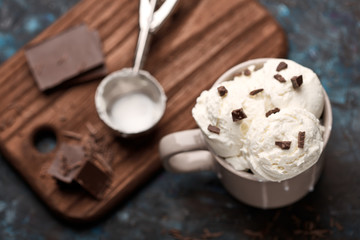 Ice cream balls, scoops and waffle cones on dark background. Advertising space.