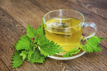Glass Cup of Tea with Fresh Nettle
