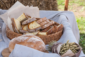 A large loaf of traditional bread cut into sandwiches