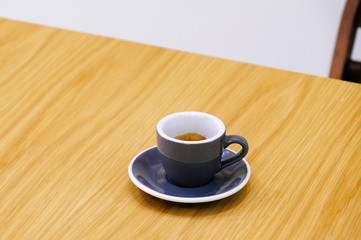 Hot espresso on wood table
