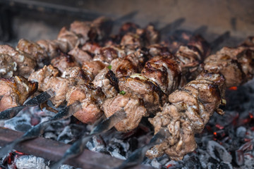 Georgian mtsvadi (Shashlik) preparation. Smoking shashlik on the grill. BBQ on Stick